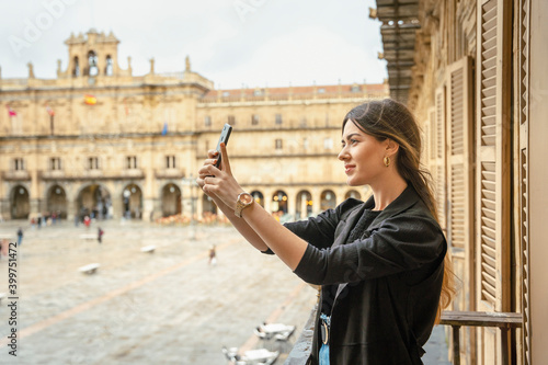 Girl taking a selfie with her phone