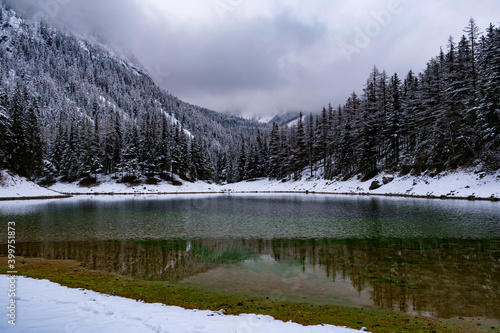 Green lake Gruner see cloudy winter day. Famous tourist destination in Styria region, Austria