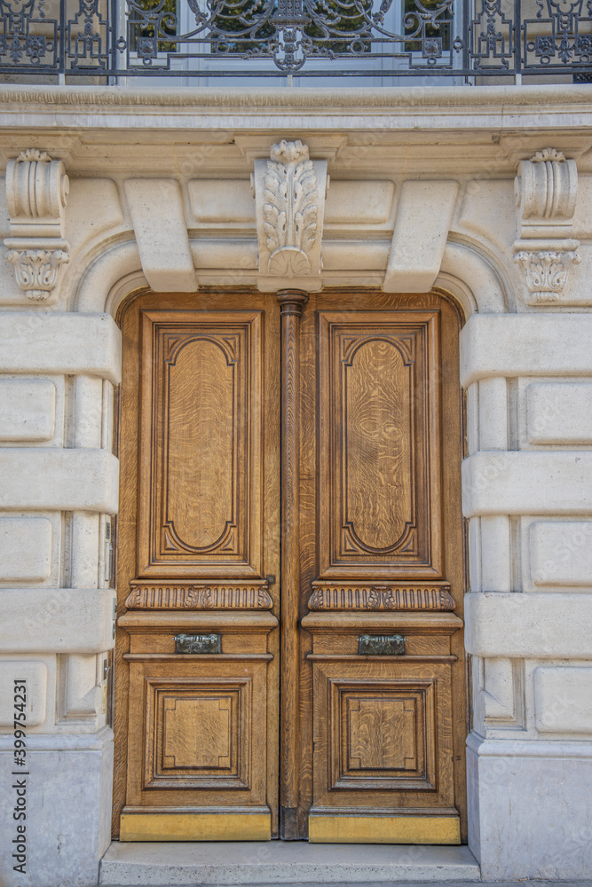 French wooden door Haussmann facade Paris France
