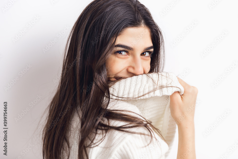 Smiling. Portrait of beautiful brunette woman in comfortable soft longsleeve isolated on white studio background. Home comfort, emotions, facial expression, winter mood concept. Copyspace. Smiling. Portrait of beautiful brunette woman in comfortable soft longsleeve isolated on white studio background. Home comfort, emotions, facial expression, winter mood concept. Copyspace.