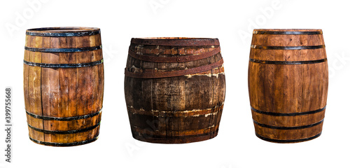 three oak barrels vertical narrow and wide for storing bourbon to give flavor on an isolated background