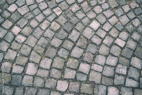 old square of european city is made of gray marble tiles pattern