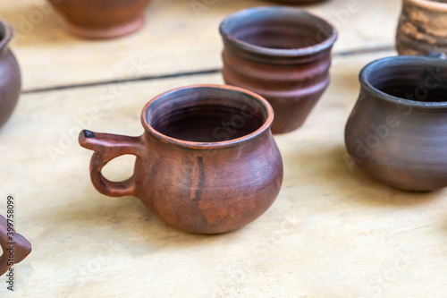traditional clay mug for beer stands next to the decanter © Kai Beercrafter