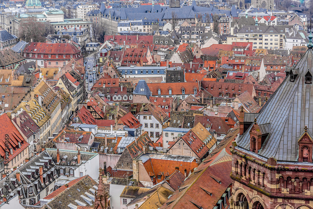 Aerial view of Strasbourg old city with red roof tiles. France. Strasbourg is the capital and principal city of Alsace region in eastern France and is official seat of European Parliament.