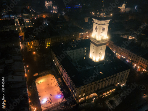 aerial view of night lvov city with ski rink