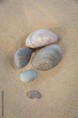 Cluster of Pebbles on Sand