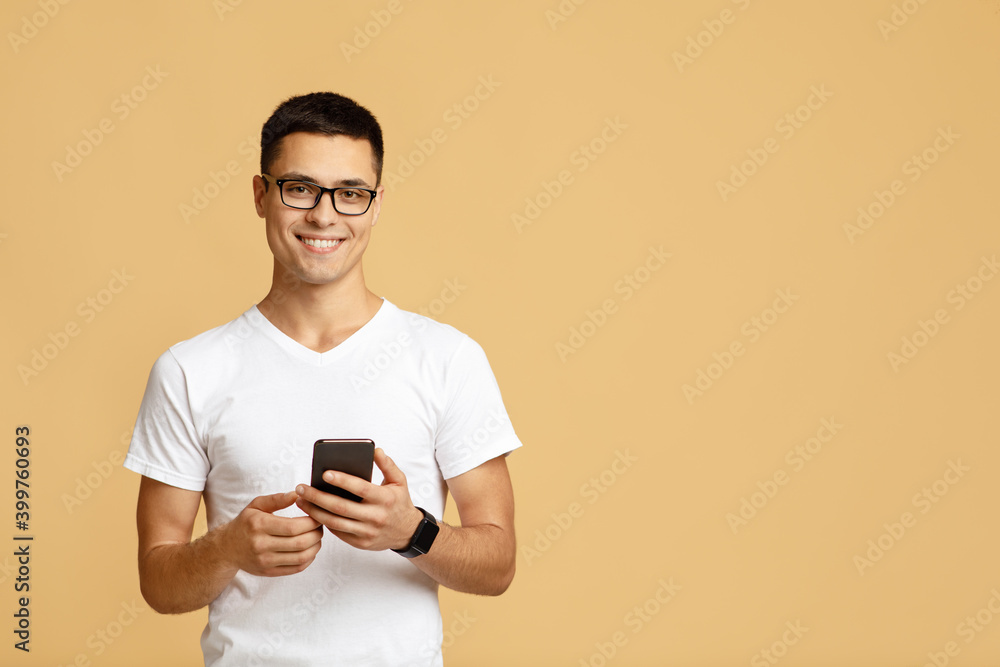 Man look at smartphone, feel joyful reading good news Man look at smartphone, feel joyful reading good news