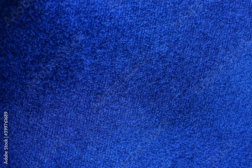 dark blue background from a piece of suede on clothes