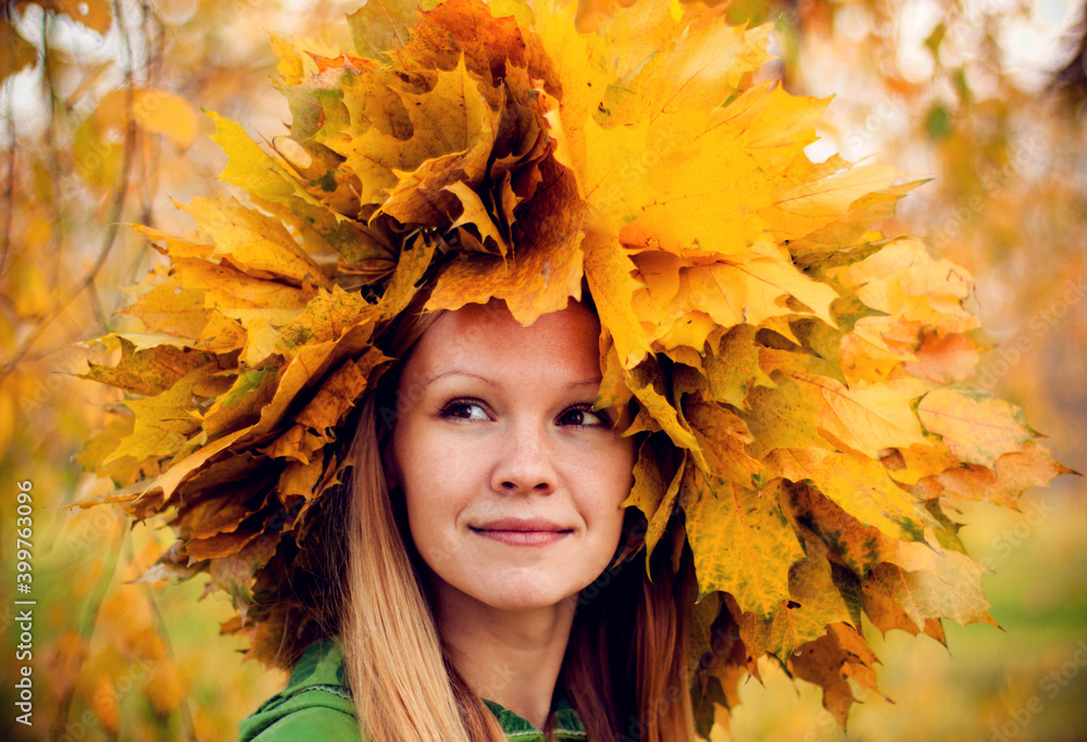 girl wearing a wreath of yellow autumn leaves girl wearing a wreath of yellow autumn leaves