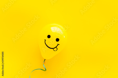 Happiness emotions painted on ballon. Positive mood background. Top view