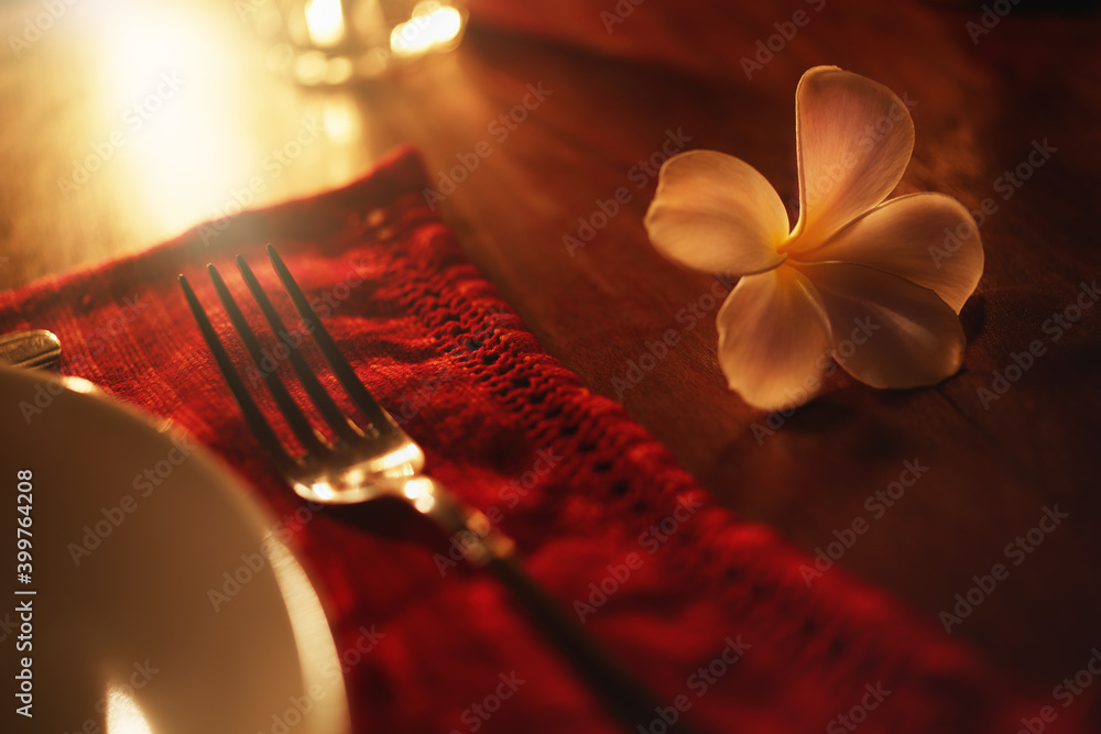 Dinner at the villa in Sri Lanka. View of the dinnerware by candlelight
