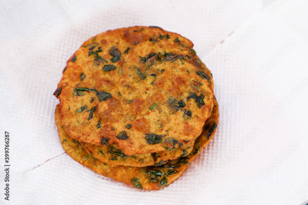 Delicious Indian Masala Puri or Methi Puri. Indian Bread Made of fenugreek leaves. Delicious Indian Masala Puri or Methi Puri. Indian Bread Made of fenugreek leaves.