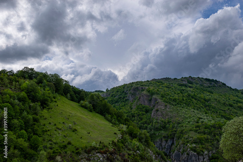 Mountain landscape against cloudy sky