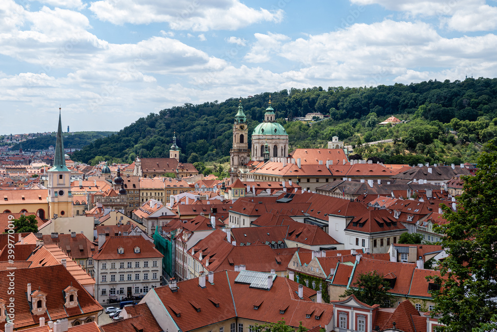 Obraz premium Prague city panorama. Orange and red roofs of the old city.