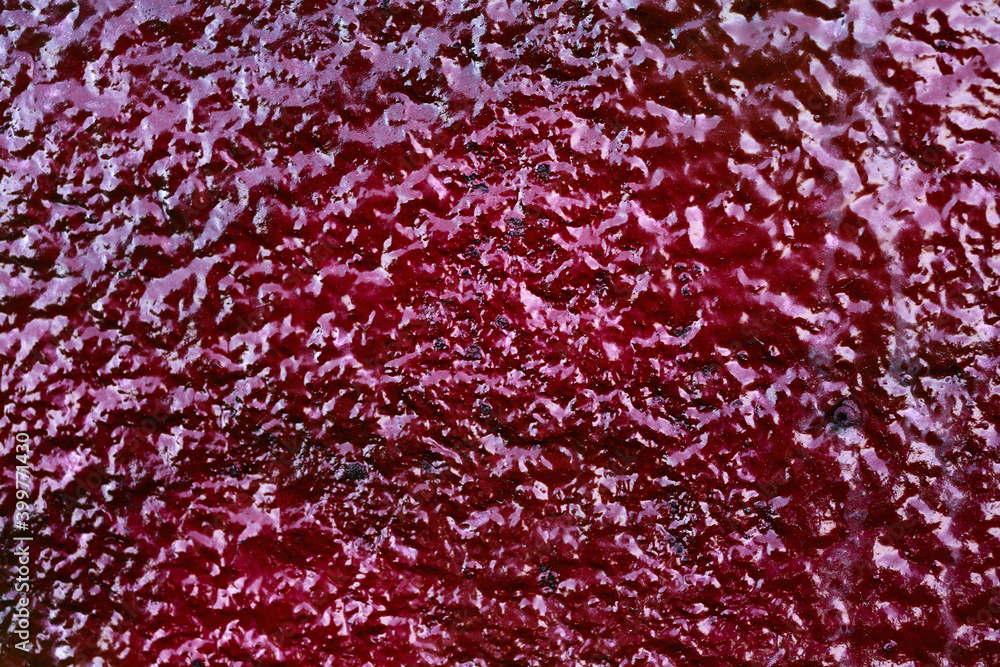 Closeup texture of old red paint on a concrete wall. Closeup texture of old red paint on a concrete wall.