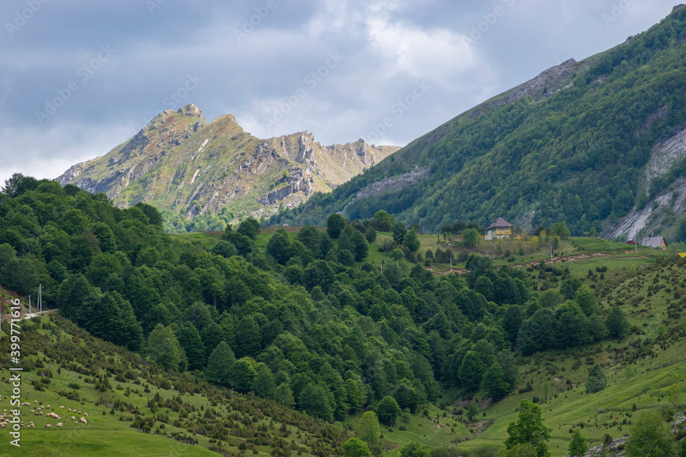 Mountain landscape against cloudy sky Mountain landscape against cloudy sky