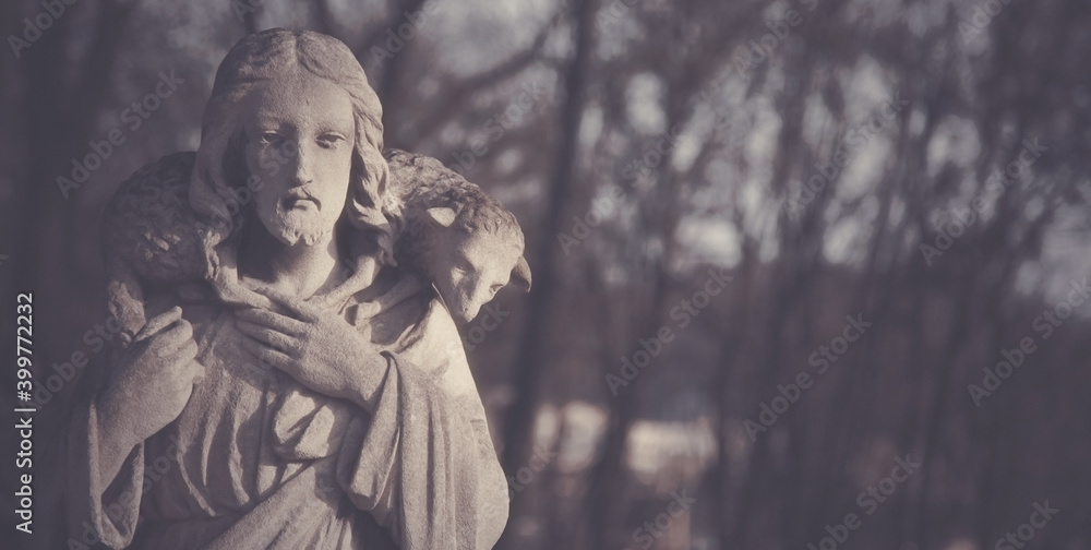 Ancient statue of Jesus Christ Good Shepherd. Free copy space for design.. Ancient statue of Jesus Christ Good Shepherd. Free copy space for design..