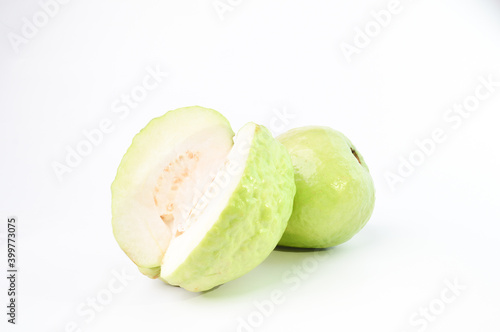 Guava fruit with sliced on wooden plate over white background.