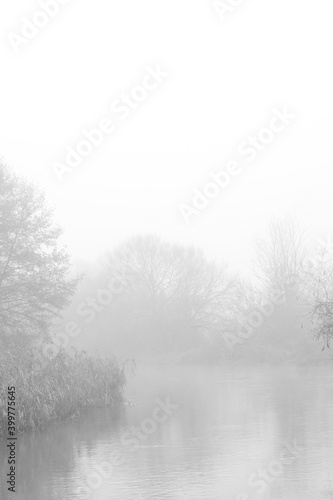 River in autumn fog