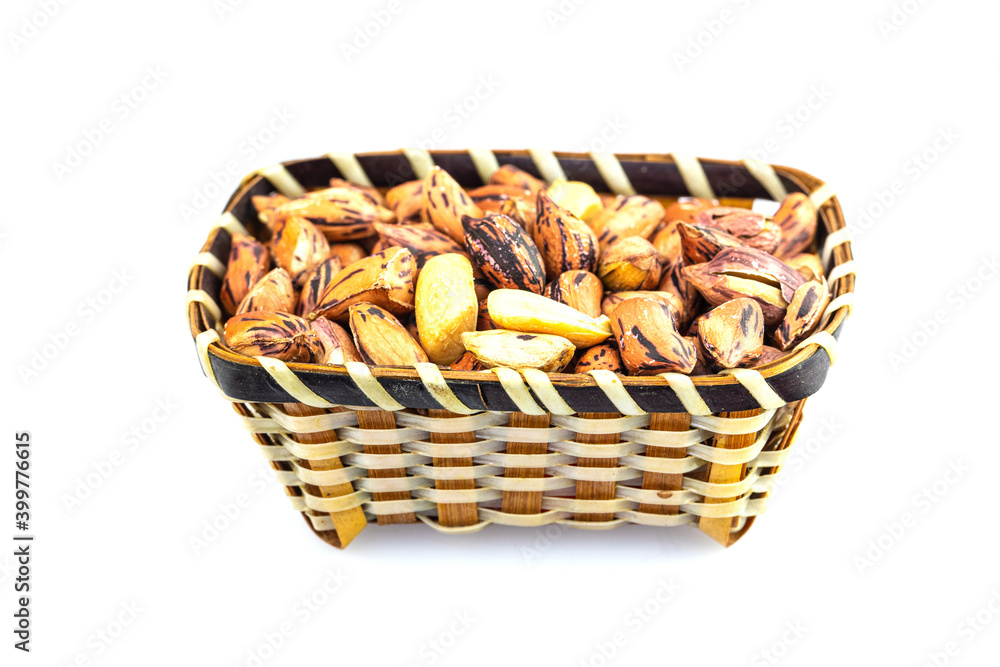 Roasted peanut in the wooden bowl isolated on white background. Roasted peanut in the wooden bowl isolated on white background.