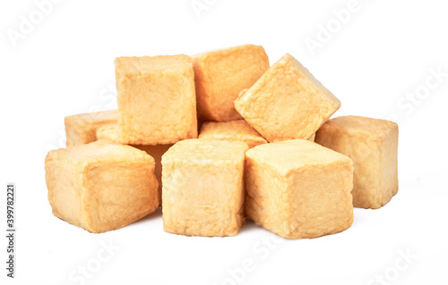 close-up of a pile of diced fish tofu isolated white background with clipping path