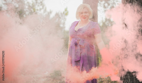 Nice plump lady portrait, lifestyle elegant woman, American chubby woman with a colorful bomb having fun outdoor