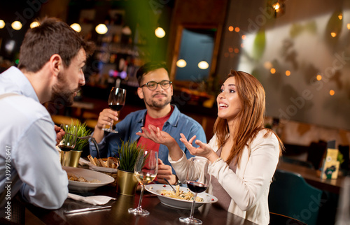 Young people having dinner ...