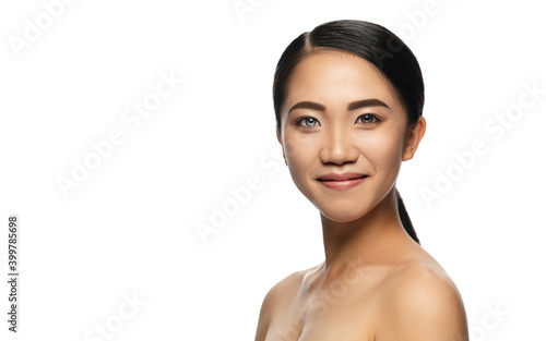 Beautiful asian woman with heterochromia isolated on white studio background. Copyspace for ad. Concept of beauty, fashion, healthcare, skincare. Complete special eyes colour, blue and brown.