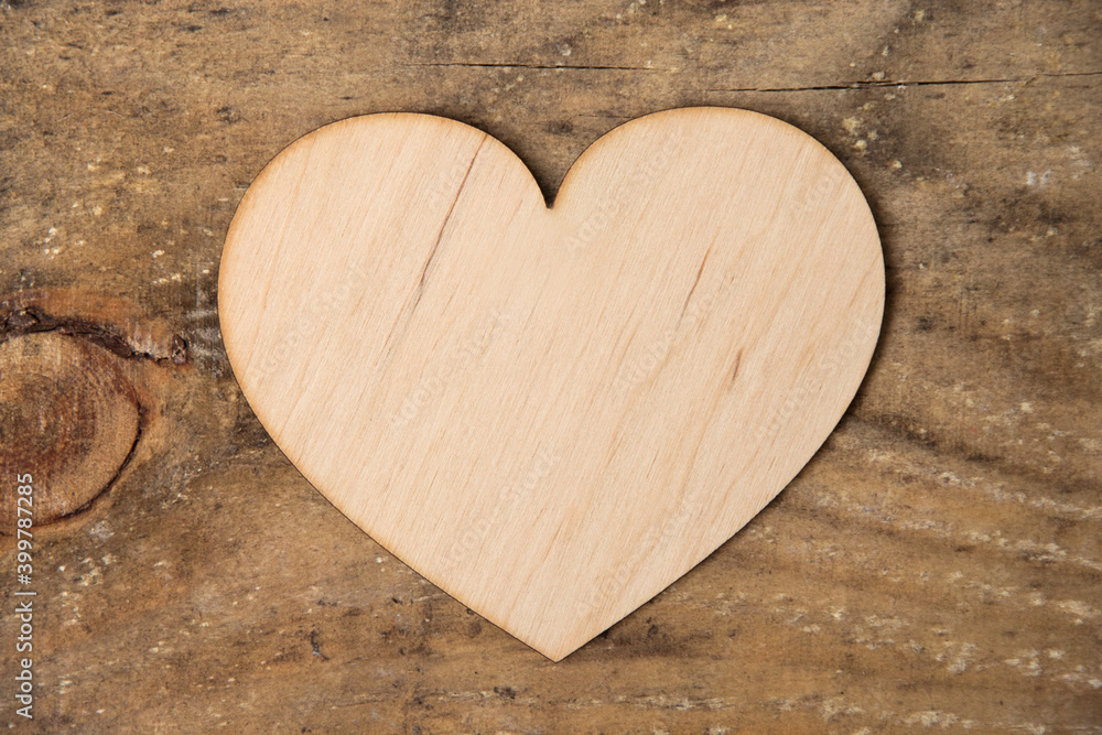 Obraz premium Wooden heart on wooden background