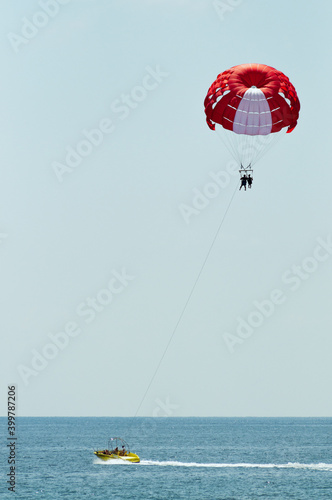 Couple flying on a paraglider 