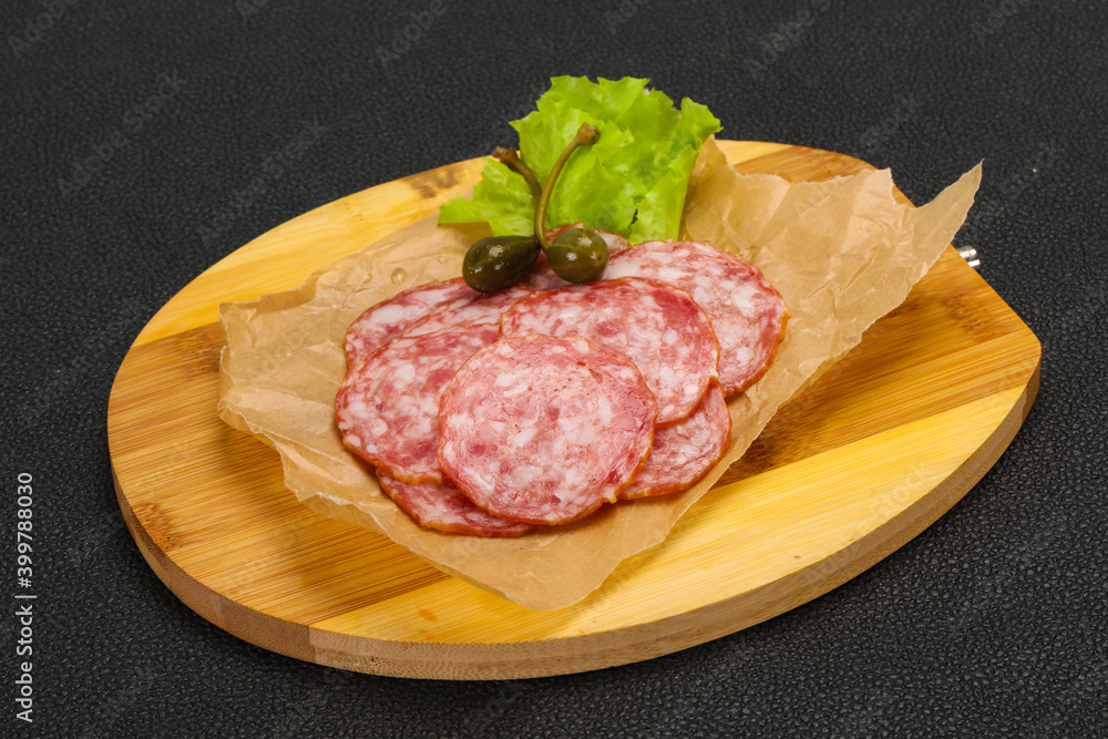 Spanish Salchichon sausage with salad Spanish Salchichon sausage with salad