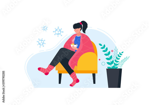 Sick woman in warm clothes drinking hot tea with lemon.
