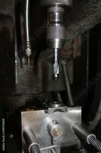 Industrial drill with countersink. Detail of the drill bit and the base.