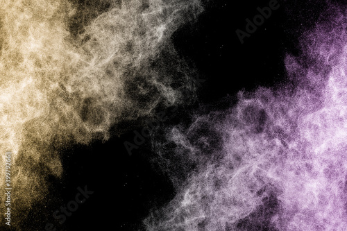 golden and purple powder splash in black background