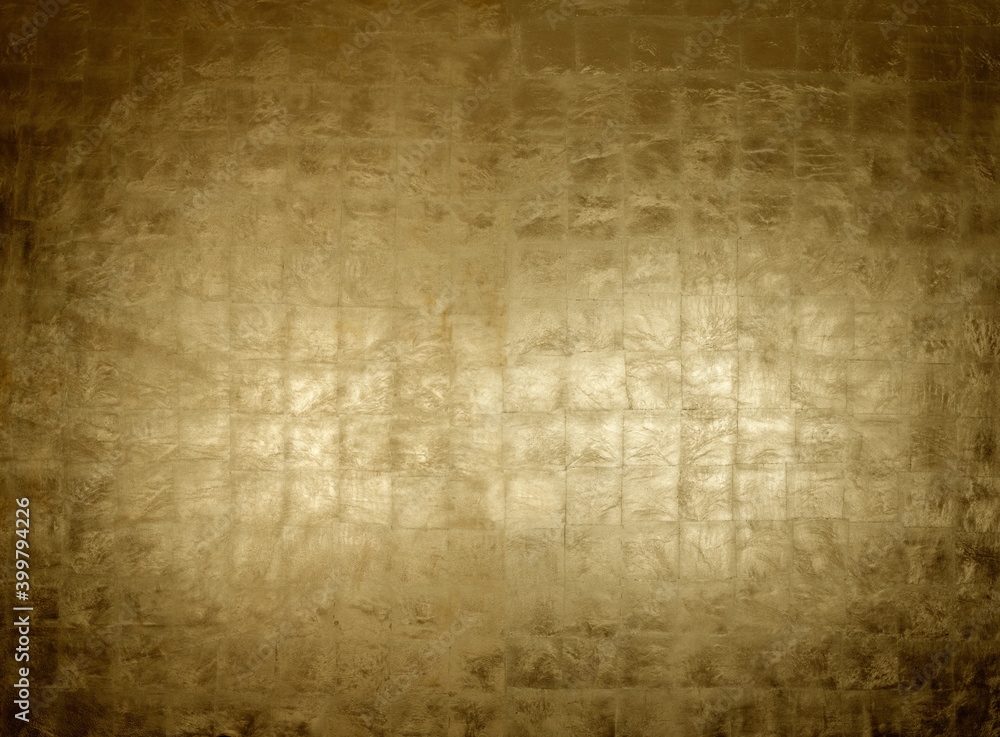 Fototapeta premium Luxurious burnished gold leaf surface on background panel