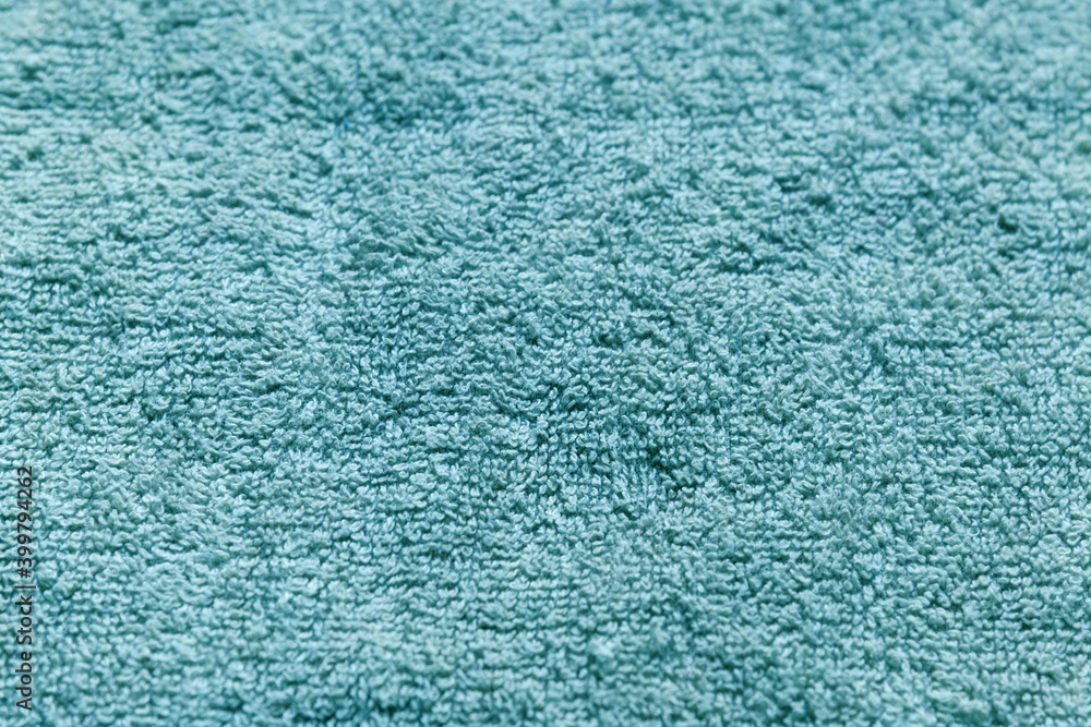 abstract background of turquoise terry towel close up abstract background of turquoise terry towel close up