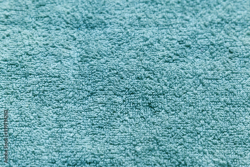 abstract background of turquoise terry towel close up