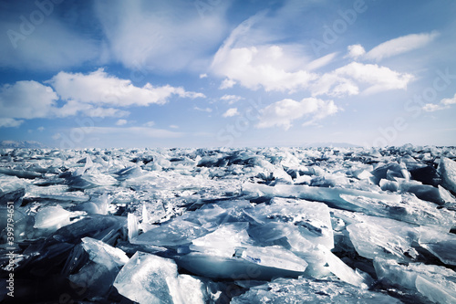 Lake Baikal in winter. Cracks and bubbles on the surface of the ice. Fantastic winter trip 