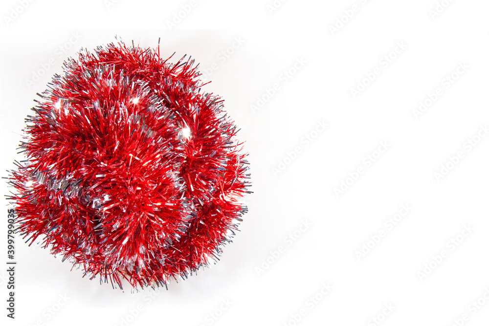 Red tinsel and a white background. Christmas preparation