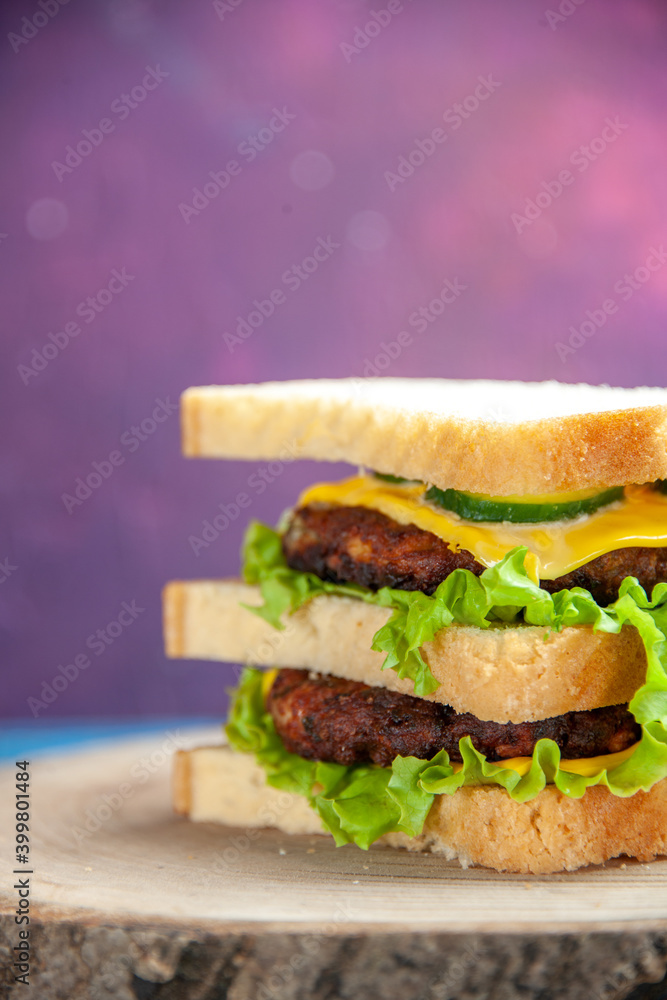 front view tasty meat sandwich with green salad on the colored background burger meal fast food color photo