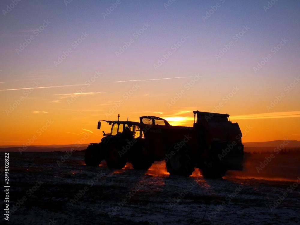 Fototapeta premium tractor at sunset