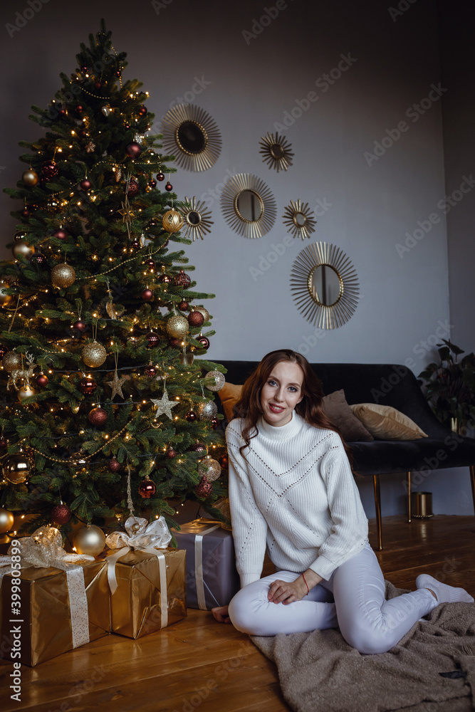 Beauty woman near Christmas tree with presents. New Year Concept. Beauty woman near Christmas tree with presents. New Year Concept.