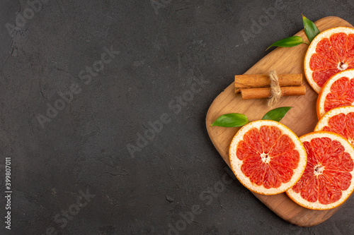 top view fresh grapefruit slices lined on dark background juice health fruit diet fresh color free space