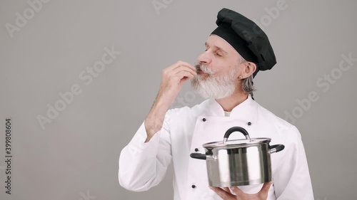 person with a hat chef calling for help chef cook restaurant food beard hat portrait young person isolated fashion handsome white guy men face studio casual thinking people model senior old photo