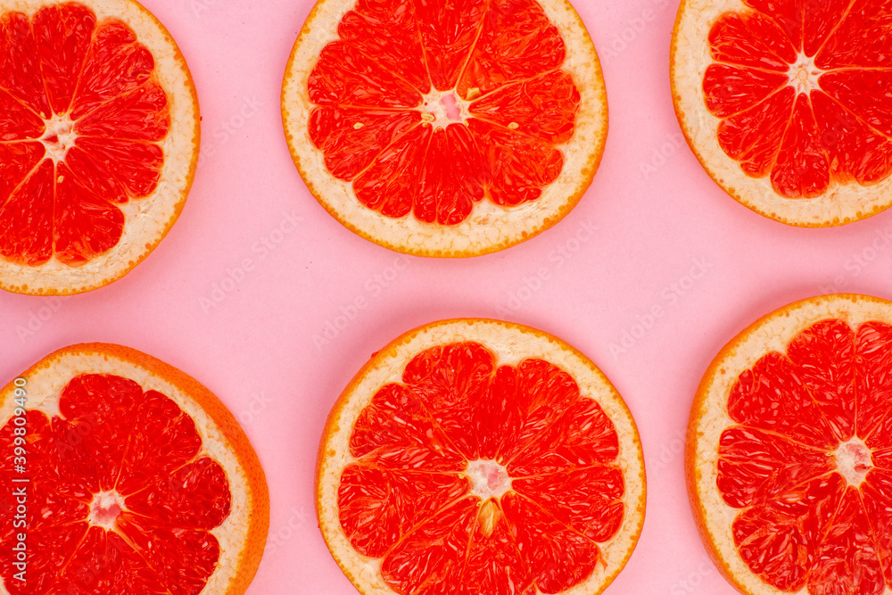 top view tasty grapefruits sliced juicy fruits lined on pink background juice fresh fruit color citrus diet top view tasty grapefruits sliced juicy fruits lined on pink background juice fresh fruit color citrus diet