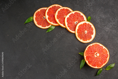 top view fresh grapefruit slices on dark background fruit color orange juice taste