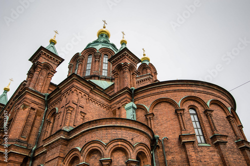 Close detail of Uspenski Orthodox Cathedral, with grey sky in the background, Helsinki, Finland photo