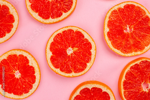 top view tasty grapefruits lined on a pink background juice fresh fruit color citrus diet