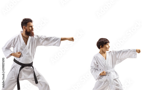Teacher and boy practicing karate kata