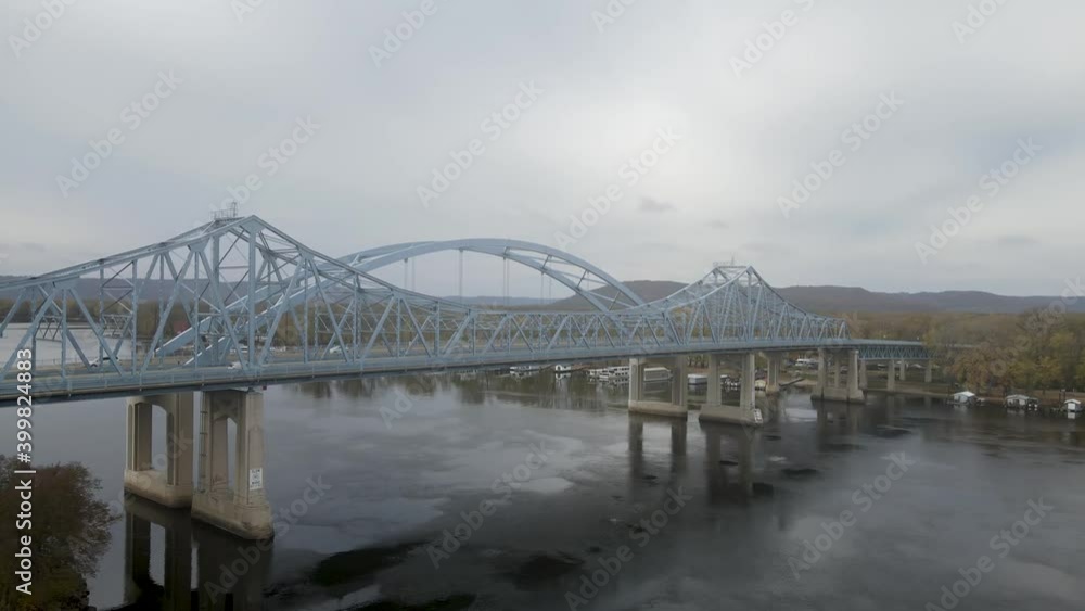 Aerial view of vehicles crossing the Mississippi River. Trucks crossing Cass Street Bridge in La Crosse, Wisconsin. Aerial view of vehicles crossing the Mississippi River. Trucks crossing Cass Street Bridge in La Crosse, Wisconsin.